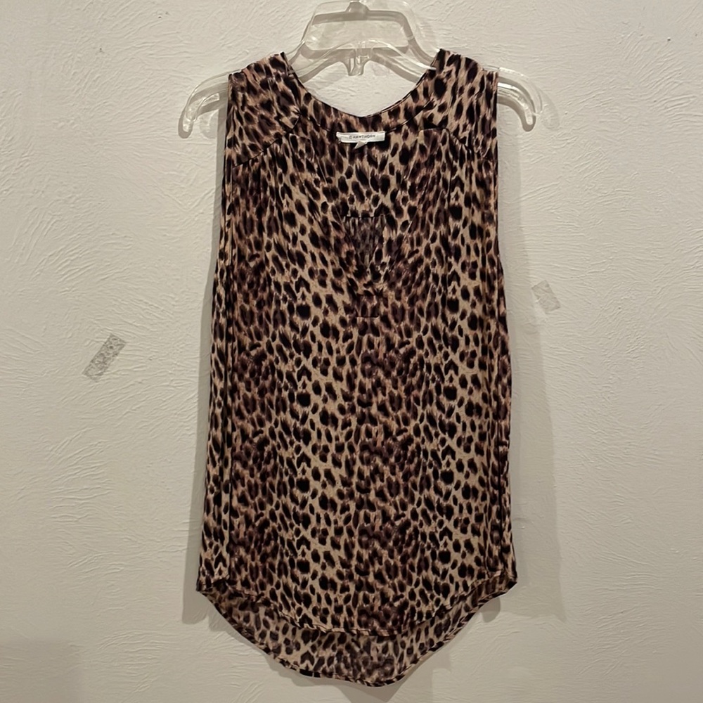 Sleeveless animal print blouse.
